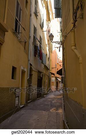 Buildings along an alley, Nice, France View Large Photo Image Picture - Buildings along an alley, Nice, France. Fotosearch