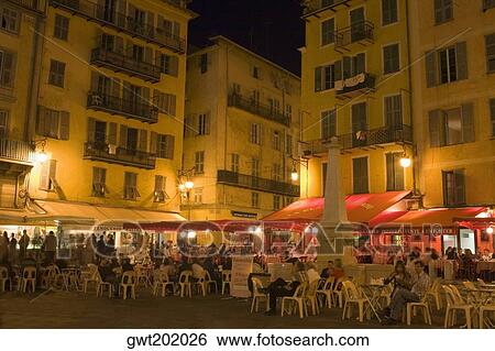 Group of people sitting at a sidewalk cafe, Nice, France View Large Photo Image Stock Photograph - Group of people sitting at a sidewalk cafe, Nice, France. Fotosearch