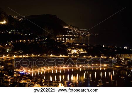 High angle view of buildings lit up at night, Nice, France View Large Photo Image Stock Photography - High angle view of buildings lit up at night, Nice, France. Fotosearch