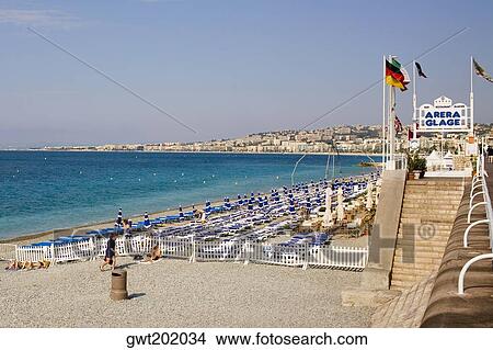 Lounge chairs on the beach, Nice, France View Large Photo Image Picture - Lounge chairs on the beach, Nice, France. Fotosearch