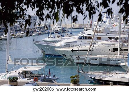 Passenger ships and tourboats at a harbor, Nice, France View Large Photo Image Stock Photography - Passenger ships and tourboats at a harbor, Nice, France. Fotosearch