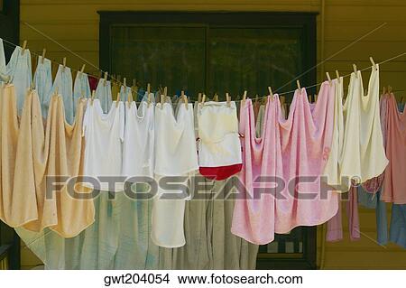 Clothes hanging on a clothesline, Providencia y Santa Catalina, San Andres y Providencia Department, Colombia View Large Photo Image Picture - Clothes hanging on a clothesline, Providencia y Santa Catalina, San Andres y Providencia Department, Colombia. Fotosearch