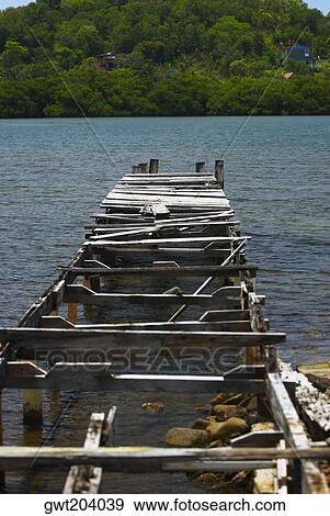 Damaged pier in the sea, Providencia y Santa Catalina, San Andres y Providencia Department, Colombia View Large Photo Image Stock Photo - Damaged pier in the sea, Providencia y Santa Catalina, San Andres y Providencia Department, Colombia. Fotosearch