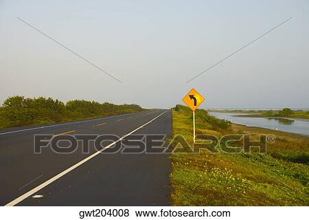 Direction sign near the road, Cienaga, Atlantico, Colombia View Large Photo Image Stock Photo - Direction sign near the road, Cienaga, Atlantico, Colombia. Fotosearch