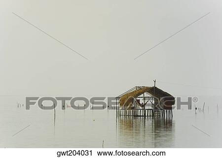 Reflection of a stilt house in water, Cienaga, Atlantico, Colombia View Large Photo Image Stock Image - Reflection of a stilt house in water, Cienaga, Atlantico, Colombia. Fotosearch