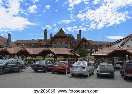 Stock Photograph - Cars parked in front of a building, San Carlos De Bariloche, Argentina. Fotosearch