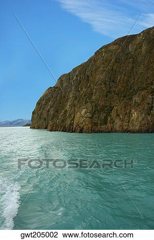 Cliff at a lakeside, Lake Argentino, Patagonia, Argentina View Large Photo Image Stock Image - Cliff at a lakeside, Lake Argentino, Patagonia, Argentina. Fotosearch