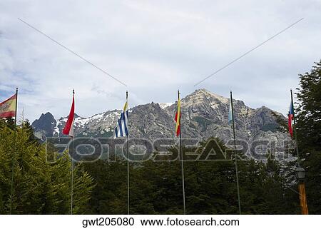 Flags and trees in front of mountains, San Carlos De Bariloche, Argentina View Large Photo Image Stock Image - Flags and trees in front of mountains, San Carlos De Bariloche, Argentina. Fotosearch