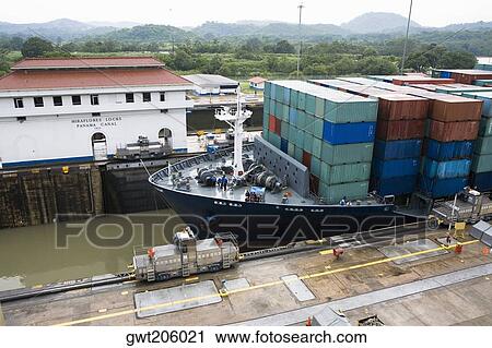 Stock Image - Cargo containers in a container ship at a commercial dock, Miraflores Locks, Panama Canal, Panama. Fotosearch