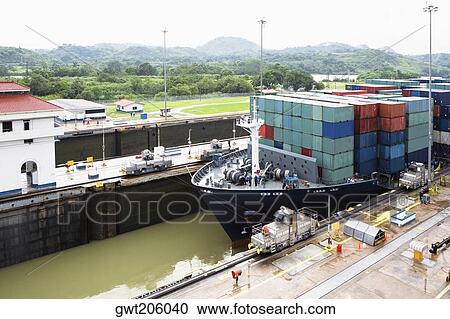 Cargo containers in a container ship at a commercial dock, Panama Canal, Panama View Large Photo Image Stock Image - Cargo containers in a container ship at a commercial dock, Panama Canal, Panama. Fotosearch