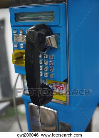 Stock Photograph - Close-up of a landline phone in a telephone booth, Old Panama, Panama City, Panama. Fotosearch