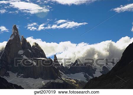 Clouds over mountains, Cerro Torre, Argentine Glaciers National Park, Mt Fitzroy, Chalten, Southern Patagonian Ice Field, Patagonia, Argentina View Large Photo Image Stock Photo - Clouds over mountains, Cerro Torre, Argentine Glaciers National Park, Mt Fitzroy, Chalten, Southern Patagonian Ice Field, Patagonia, Argentina. Fotosearch