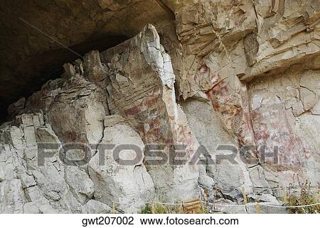 Stock Image - Hand signs on a rock, Cave of the Hands, Pinturas River, Patagonia, Argentina. Fotosearch