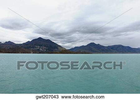Lake in front of a mountain range, Lake Argentino, Patagonia, Argentina View Large Photo Image Stock Image - Lake in front of a mountain range, Lake Argentino, Patagonia, Argentina. Fotosearch