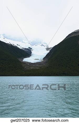 Lake in front of mountains, Argentine Glaciers National Park, Lake Argentino, El Calafate, Patagonia, Argentina View Large Photo Image Stock Photography - Lake in front of mountains, Argentine Glaciers National Park, Lake Argentino, El Calafate, Patagonia, Argentina. Fotosearch