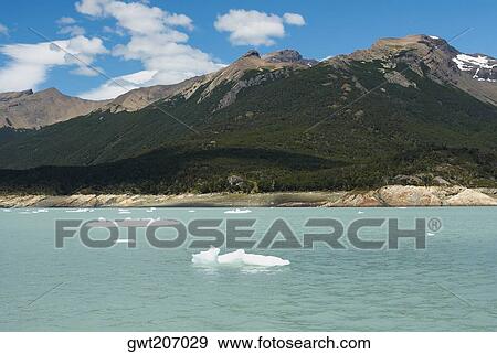 Lake in front of mountains, Lake Argentino, Patagonia, Argentina View Large Photo Image Stock Photo - Lake in front of mountains, Lake Argentino, Patagonia, Argentina. Fotosearch