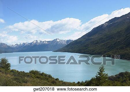 Lake passing through a mountain range, Lake Argentino, Patagonia, Argentina View Large Photo Image Stock Photo - Lake passing through a mountain range, Lake Argentino, Patagonia, Argentina. Fotosearch