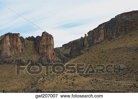 Stock Photo - Rock formations on a landscape, Pinturas River, Patagonia, Argentina. Fotosearch