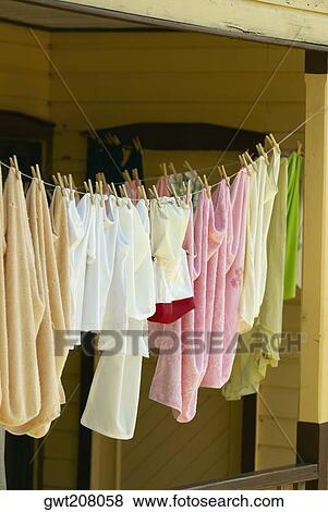 Clothes hanging on a clothesline, Providencia y Santa Catalina, San Andres y Providencia Department, Colombia View Large Photo Image Stock Photo - Clothes hanging on a clothesline, Providencia y Santa Catalina, San Andres y Providencia Department, Colombia. Fotosearch
