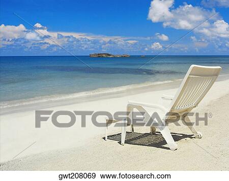 Empty lounge chair on the beach, South West Bay, Providencia, Providencia y Santa Catalina, San Andres y Providencia Department, Colombia View Large Photo Image Stock Photo - Empty lounge chair on the beach, South West Bay, Providencia, Providencia y Santa Catalina, San Andres y Providencia Department, Colombia. Fotosearch