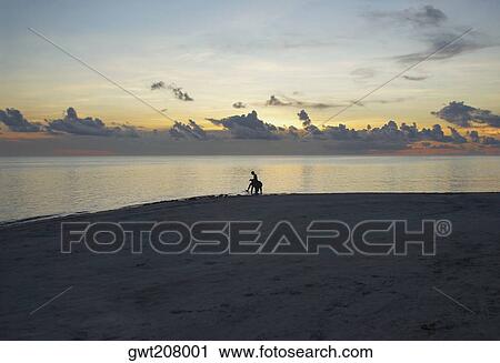 Silhouette of a person on the beach, South West Bay, Providencia, Providencia y Santa Catalina, San Andres y Providencia Department, Colombia View Large Photo Image Stock Image - Silhouette of a person on the beach, South West Bay, Providencia, Providencia y Santa Catalina, San Andres y Providencia Department, Colombia. Fotosearch
