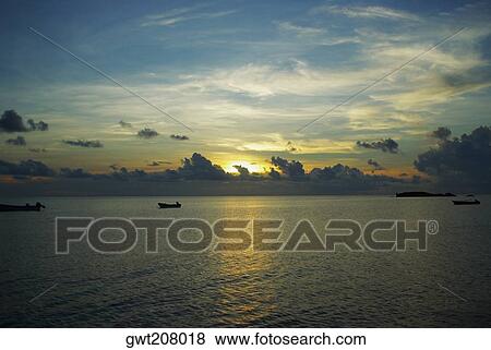 Sunset over the sea, South West Bay, Providencia, Providencia y Santa Catalina, San Andres y Providencia Department, Colombia View Large Photo Image Stock Photo - Sunset over the sea, South West Bay, Providencia, Providencia y Santa Catalina, San Andres y Providencia Department, Colombia. Fotosearch
