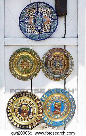 Ceramics plates hanging on the door, Cancun, Mexico View Large Photo Image Stock Photography - Ceramics plates hanging on the door, Cancun, Mexico. Fotosearch