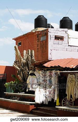 Clothes hanging in a store, Cancun, Mexico View Large Photo Image Stock Photo - Clothes hanging in a store, Cancun, Mexico. Fotosearch
