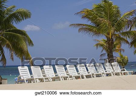 Beach chairs on the beach, Roatan, Bay Islands, Honduras View Large Photo Image Stock Photograph - Beach chairs on the beach, Roatan, Bay Islands, Honduras. Fotosearch