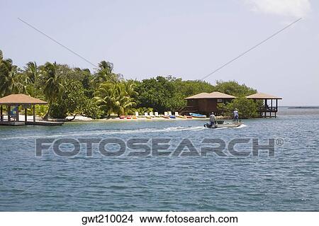 Picture - Beach hut on the beach, Sandy Bay, Roatan, Bay Islands, Honduras. Fotosearch