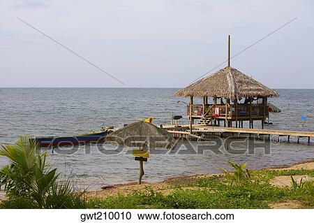 Beach hut on the pier, Paya Bay Resort, Roatan, Bay Islands, Honduras View Large Photo Image Stock Image - Beach hut on the pier, Paya Bay Resort, Roatan, Bay Islands, Honduras. Fotosearch