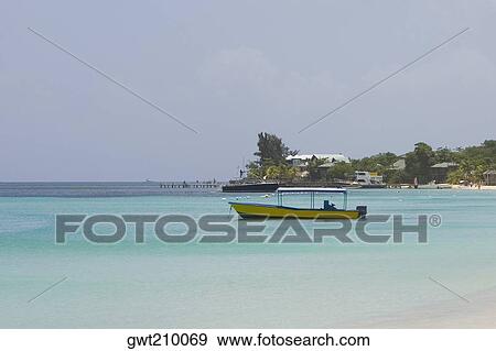 Stock Photo - Boat in the sea, West Bay Beach, Roatan, Bay Islands, Honduras. Fotosearch