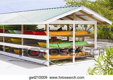 Group of canoes in a stand, Dixon Cove, Roatan, Bay Islands, Honduras View Large Photo Image Stock Photo - Group of canoes in a stand, Dixon Cove, Roatan, Bay Islands, Honduras. Fotosearch