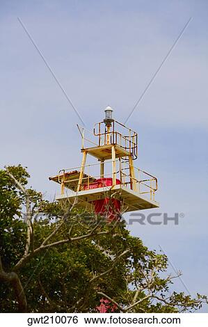 Low angle view of a lighthouse, Roatan, Bay Islands, Honduras View Large Photo Image Stock Photograph - Low angle view of a lighthouse, Roatan, Bay Islands, Honduras. Fotosearch