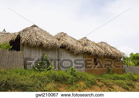 Low angle view of huts in a row, French Harbour, Rotan, Bay Islands, Honduras View Large Photo Image Stock Photo - Low angle view of huts in a row, French Harbour, Rotan, Bay Islands, Honduras. Fotosearch