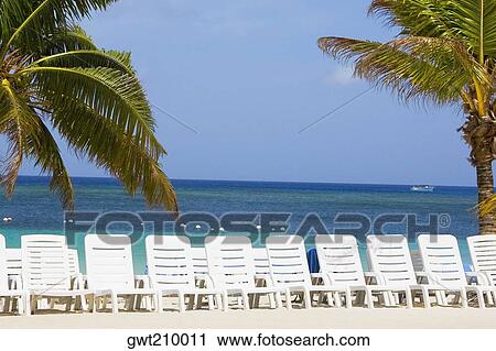 Rear view of a woman standing on the beach, Honduras View Large Photo Image Stock Image - Rear view of a woman standing on the beach, Honduras. Fotosearch