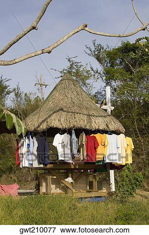 T-shirts hanging on a stall, Jonesville, Roatan, Bay Islands, Honduras View Large Photo Image Stock Photo - T-shirts hanging on a stall, Jonesville, Roatan, Bay Islands, Honduras. Fotosearch