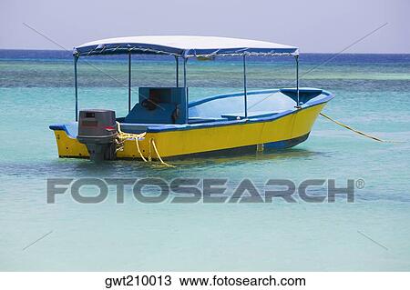 Stock Image - Tourboat in the sea, West Bay Beach, Roatan, Bay Islands, Honduras. Fotosearch