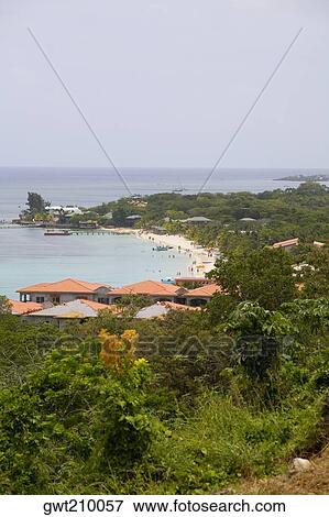 Stock Photo - Tourist resorts on the beach, West Bay Beach, Roatan, Bay Islands, Honduras. Fotosearch