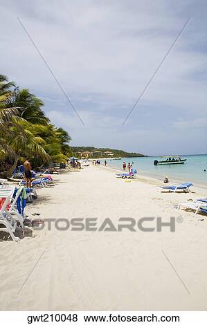 Tourists on the beach, Honduras View Large Photo Image Stock Photo - Tourists on the beach, Honduras. Fotosearch