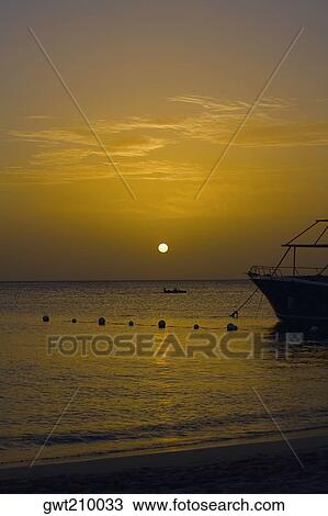 Yacht in the sea at sunset, West Bay Beach, Roatan, Bay Islands, Honduras View Large Photo Image Stock Image - Yacht in the sea at sunset, West Bay Beach, Roatan, Bay Islands, Honduras. Fotosearch