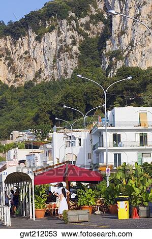 Stock Image - Buildings with a mountain in the background, Capri, Campania, Italy. Fotosearch