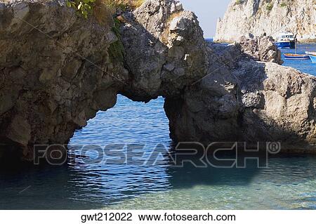 Close-up of a natural arch in a rock formation, Faraglioni Rocks, Capri, Campania, Italy View Large Photo Image Stock Image - Close-up of a natural arch in a rock formation, Faraglioni Rocks, Capri, Campania, Italy. Fotosearch