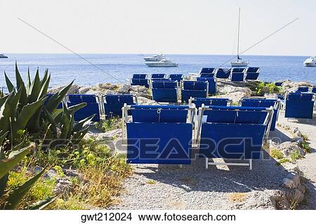 Deck chairs on the beach, Capri, Campania, Italy View Large Photo Image Picture - Deck chairs on the beach, Capri, Campania, Italy. Fotosearch