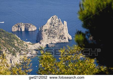 High angle view of rock formations in the sea, Faraglioni Rocks, Capri, Campania, Italy View Large Photo Image Stock Image - High angle view of rock formations in the sea, Faraglioni Rocks, Capri, Campania, Italy. Fotosearch