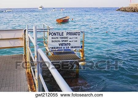 Information board on a pier, Capri, Campania, Italy View Large Photo Image Stock Photography - Information board on a pier, Capri, Campania, Italy. Fotosearch
