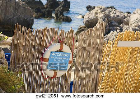 Information board with a life belt on a wooden fence, Capri, Campania, Italy View Large Photo Image Stock Image - Information board with a life belt on a wooden fence, Capri, Campania, Italy. Fotosearch