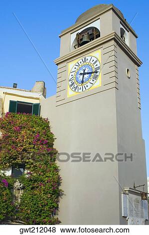 Stock Photo - Low angle view of a clock Tower, Piazza Umberto, Capri, Campania, Italy. Fotosearch