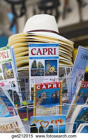 Magazines and sun hats at a market stall, Capri, Campania, Italy View Large Photo Image Stock Photography - Magazines and sun hats at a market stall, Capri, Campania, Italy. Fotosearch
