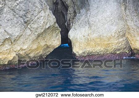 Rock formations in the sea, Capri, Campania, Italy View Large Photo Image Stock Image - Rock formations in the sea, Capri, Campania, Italy. Fotosearch